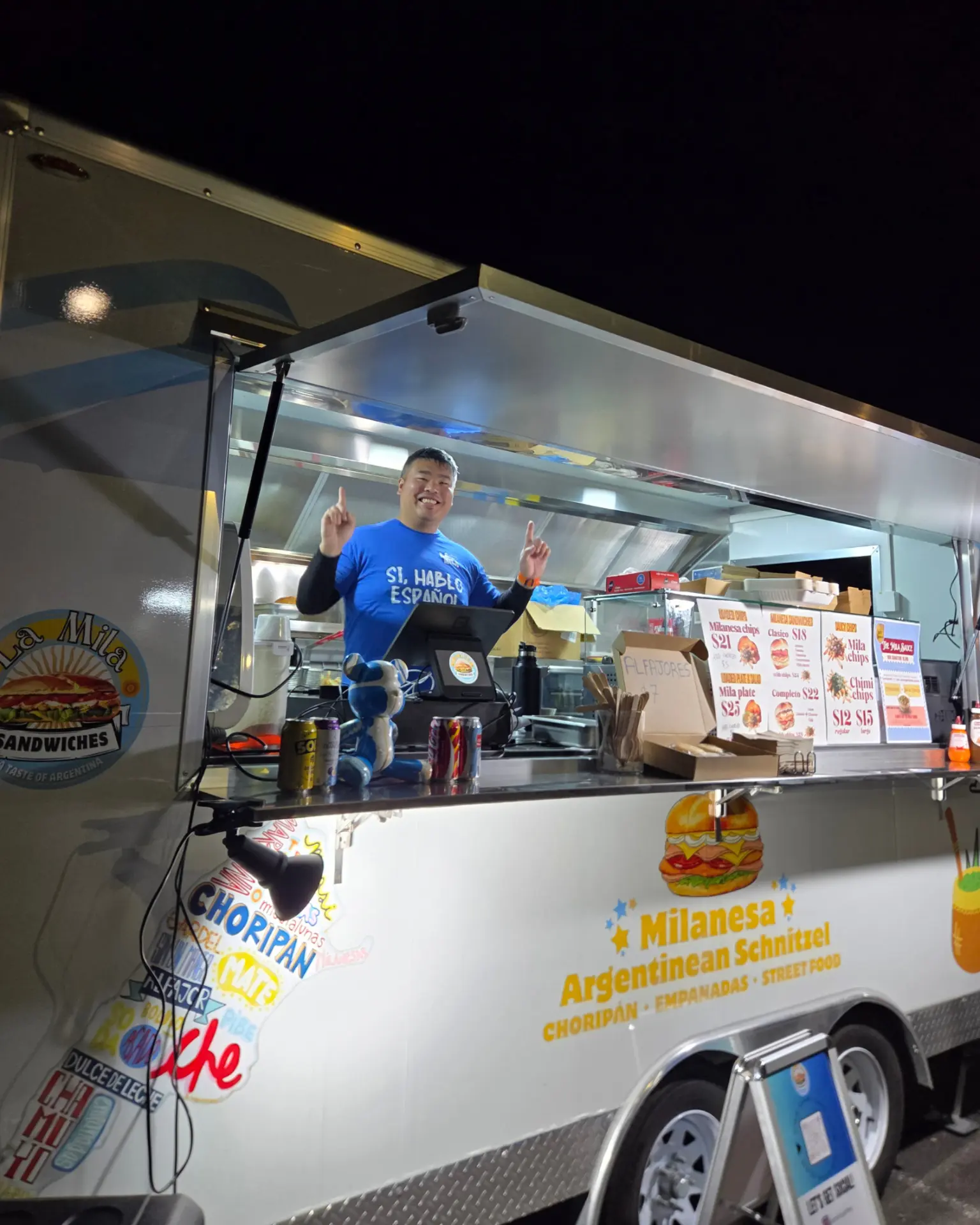 La Mila food trailer serving at night