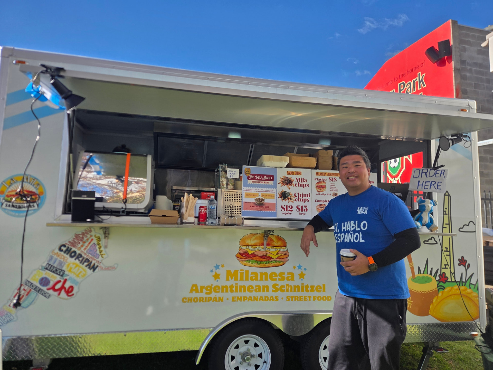 La Mila food trailer at a Sydney public event with the full menu on display
